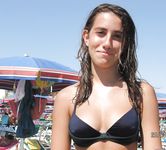 Relaxed and Seated on the Nude Beach in Sunglasses