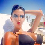 Nude Beach Sunbathing in Sunglasses on a White Towel