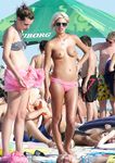 Gorgeous nude adult with a nice ass sunbathes