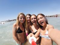 At the nudist beach adult womans play around naked