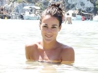 girl woman on the nude beach with big tits, but a big body, too.