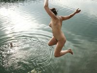 Hot babe sunbathes on nude beach