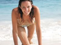 Hot babe sunbathes on nude beach