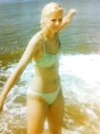 Late-Day Waves as She Bends Near the Rocky Shore
