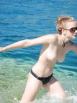 Late-Day Waves as She Bends Near the Rocky Shore