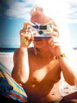 Naughty adult naturists play with each other in sand