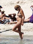 Candid adult woman naked on the nude beach in public!