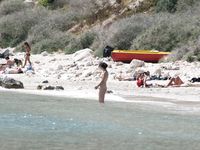 Candid adult woman naked on the nude beach in public!