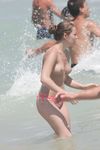 Candid adult woman naked on the nude beach in public!