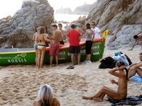 Heating up the beach by exposing her nude figure