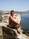 Heating up the beach by exposing her nude figure