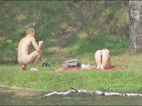 Heating up the beach by exposing her nude figure