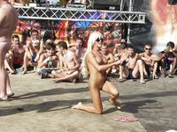 Heating up the beach by exposing her nude figure