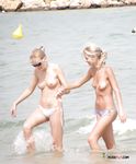 Cute teen topless at the beach