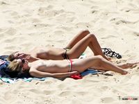 Cute teen topless at the beach