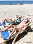 Cute teen topless at the beach