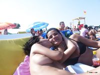 Topless ebony adult on the beach