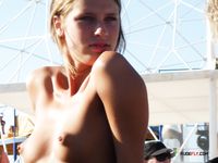 horny girl topless on the beach