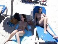 horny girl topless on the beach