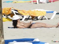 My girlfriend topless on the beach