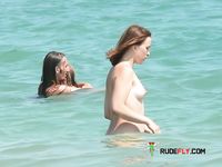 My girlfriend topless on the beach