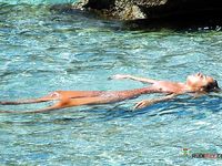 Nudist beach hairy pussy spread legs sunbath close-up