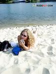 One Woman Topless in White Patterned Bikini Bottoms
