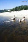 Slim adults out on the nude strand!