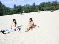 Slim adults out on the nude strand!