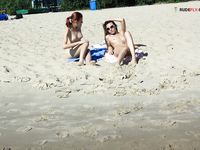 Slim adults out on the nude strand!