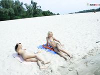 Slim adults out on the nude strand!
