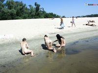 Slim adults out on the nude strand!