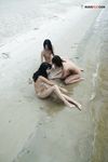 Sitting at the Waterline with Three Nudists on Wet Sand