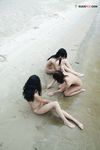 Sitting at the Waterline with Three Nudists on Wet Sand