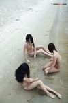 Sitting at the Waterline with Three Nudists on Wet Sand
