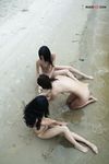 Sitting at the Waterline with Three Nudists on Wet Sand