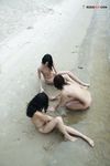 Sitting at the Waterline with Three Nudists on Wet Sand
