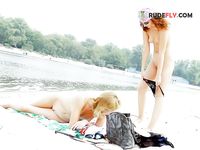 Pink Headscarf and Sunglasses at a Calm Riverbank Nude Beach