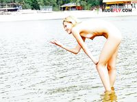 Pink Headscarf and Sunglasses at a Calm Riverbank Nude Beach