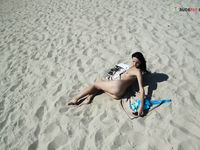 Leaning Back on a Towel at a Nude Beach Riverbank