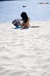 Leaning Back on a Towel at a Nude Beach Riverbank