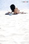 Leaning Back on a Towel at a Nude Beach Riverbank