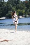 Leaning Back on a Towel at a Nude Beach Riverbank