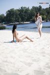 Leaning Back on a Towel at a Nude Beach Riverbank