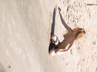 Wifwe immense boobies on OBX strand.