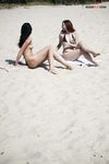 A Tender Kiss Between Two Women on a Quiet Nude Beach