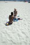 girlfriend on the strand, tanning  her hooters