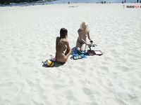 girlfriend on the strand, tanning  her hooters