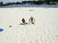 Damp Hair and Kneeling Sand on a Bright Nude Beach Dune