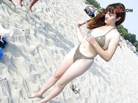 laying nude opened up broad on the strand